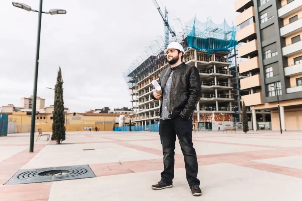 A security guard stood in front of a construction site to show the services we offer.