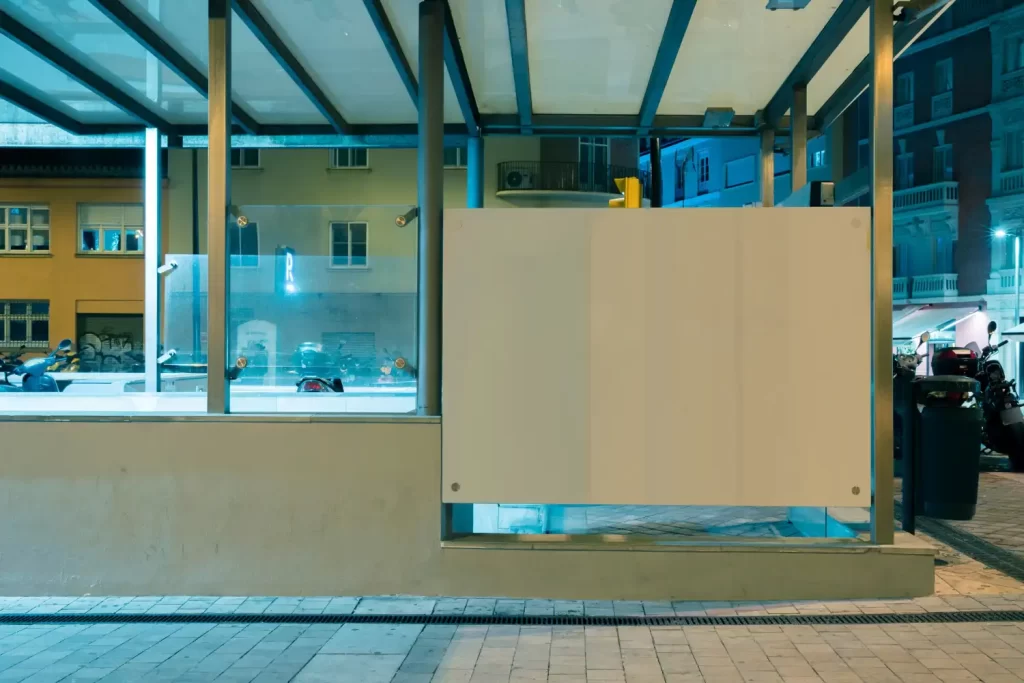 A shop window with one of the panes covered in chipboard to show the emergency boarding up services that RSM Property Solutions provides in Oxfordshire, Wiltshire and Gloucestershire.